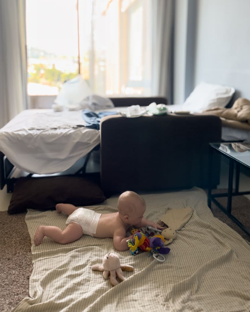 Adrian in a hotel room