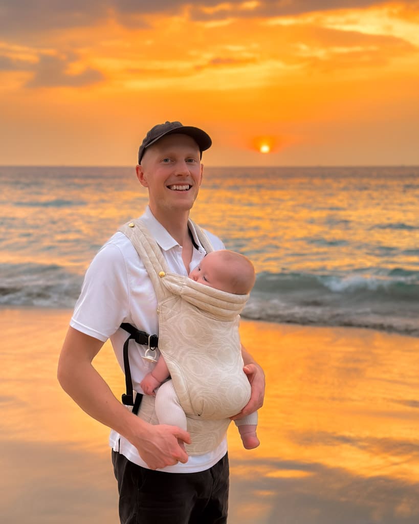 Alexander with Adrian in a baby carrier