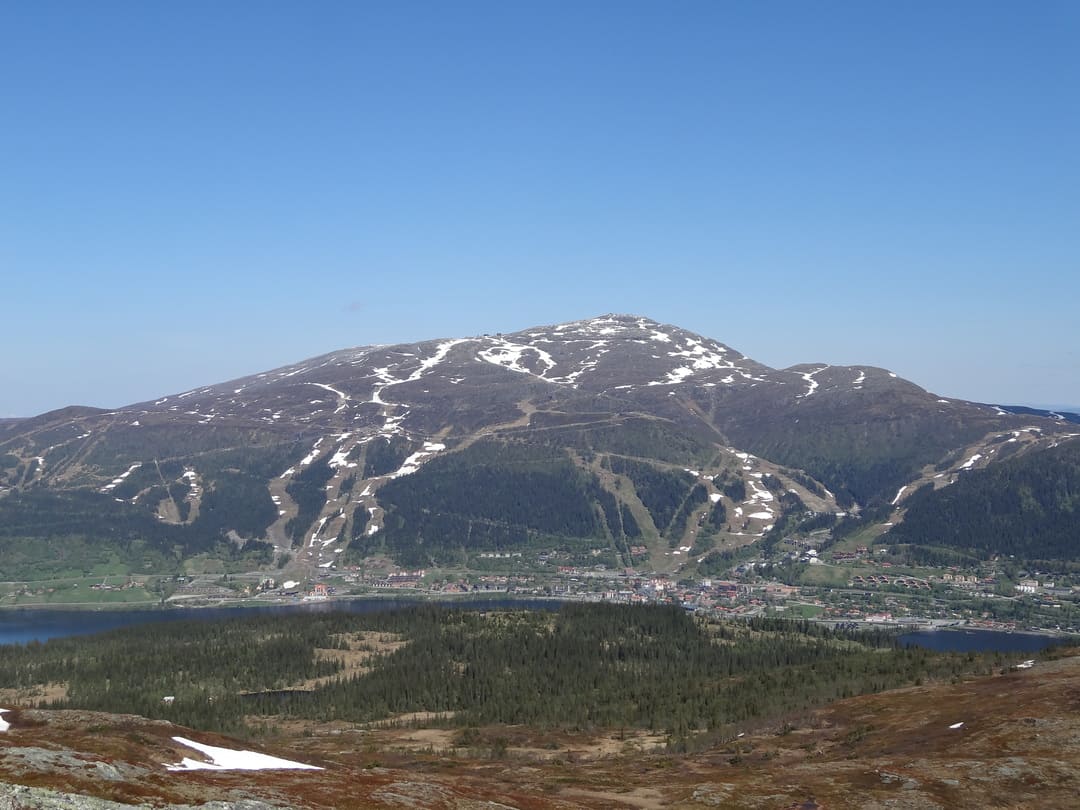 All of Åre city with Åreskutan in the background seen from the mountain on the other side of the lake