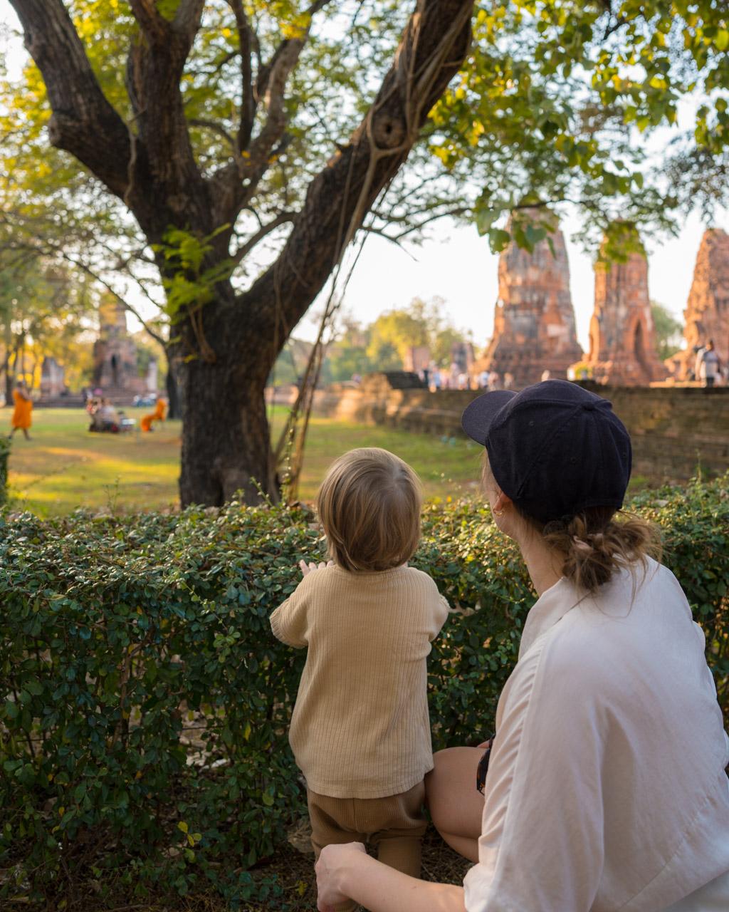 Victoria and Adrian at Wat Mahathat temple looking for squirrels in Ayutthaya