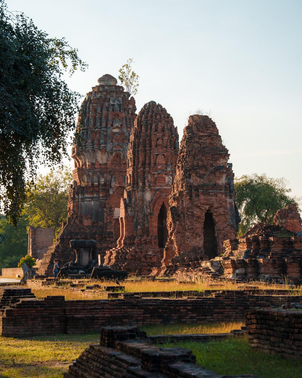 Three temple buildings at Wat Mahathat temple in the afternoon light