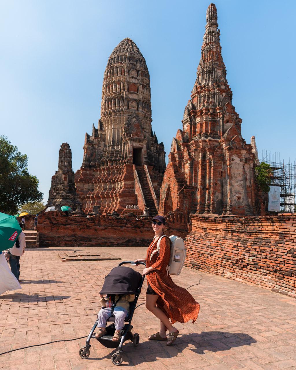 Victoria and Adrian hiding from the sun in a stroller at Wat Chaiwatthanaram