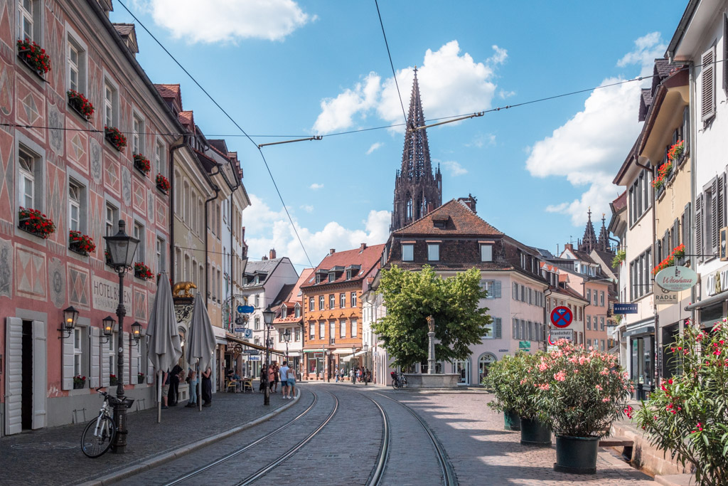 Freiburg in Baden-Württemberg street with church in background