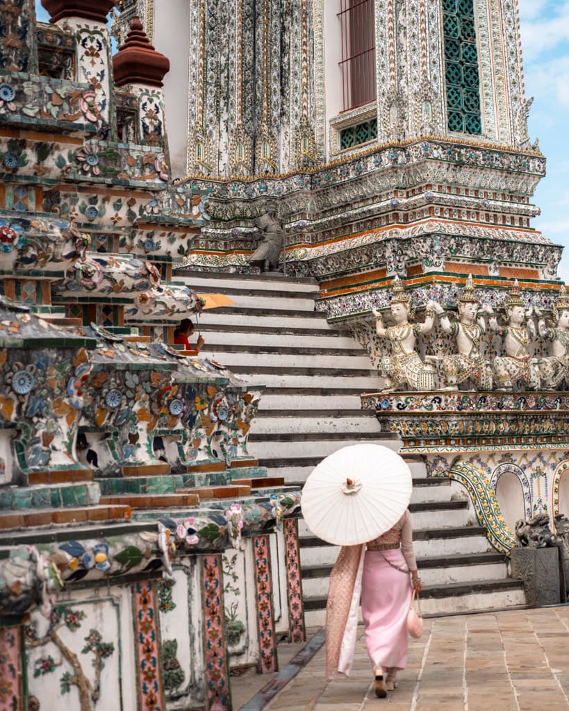 Wat Arun woman with umbrella