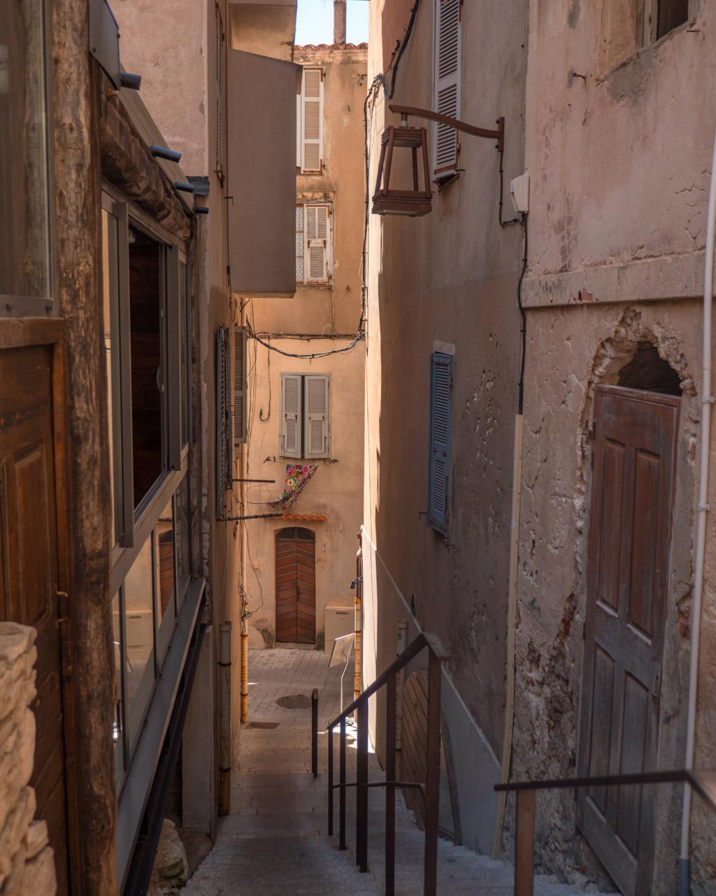 Narrow street with stairs in Bonifacio's old town