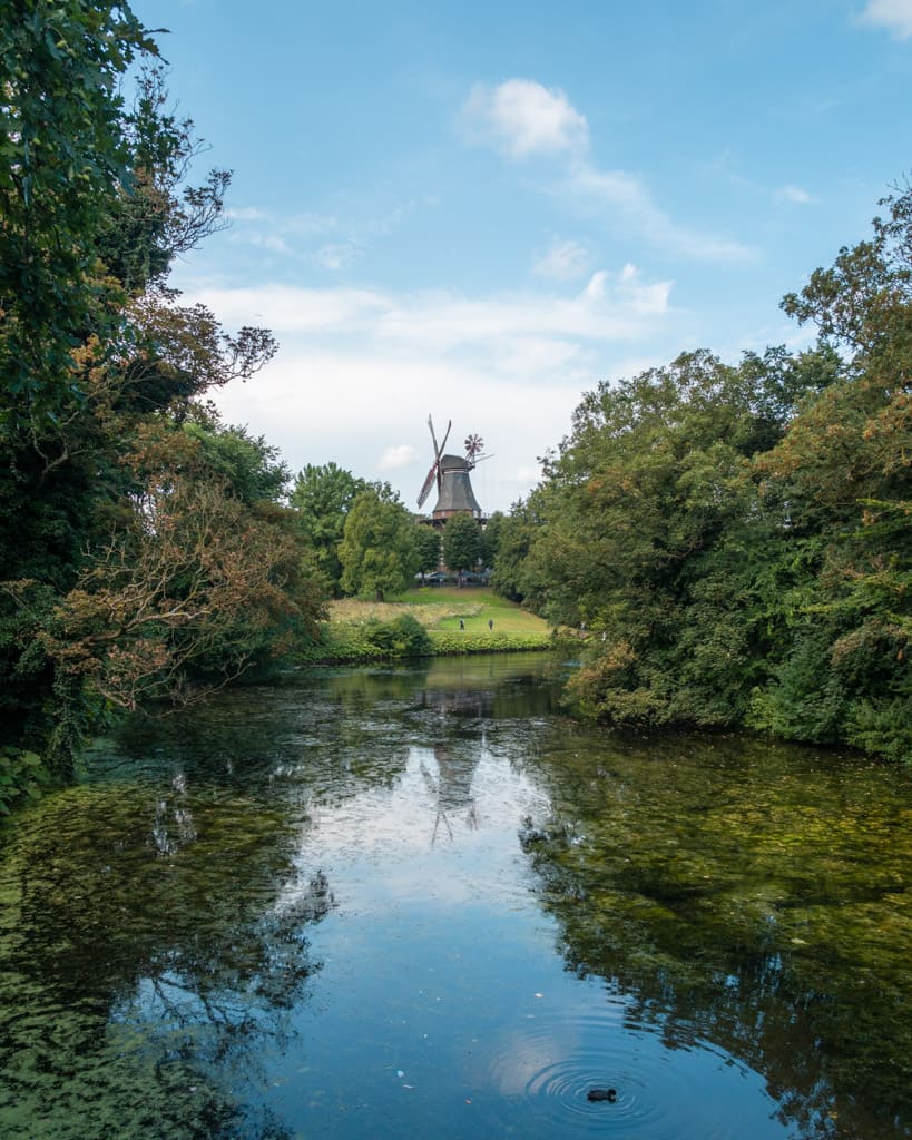 Windmill reflected in river in the Wallanlagen Park