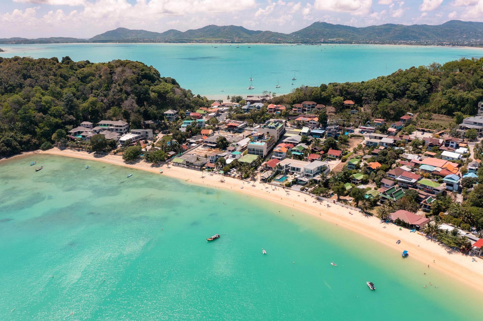 Ao Yon Beach seen from the air with Phuket Town and the southern hills seen in the background