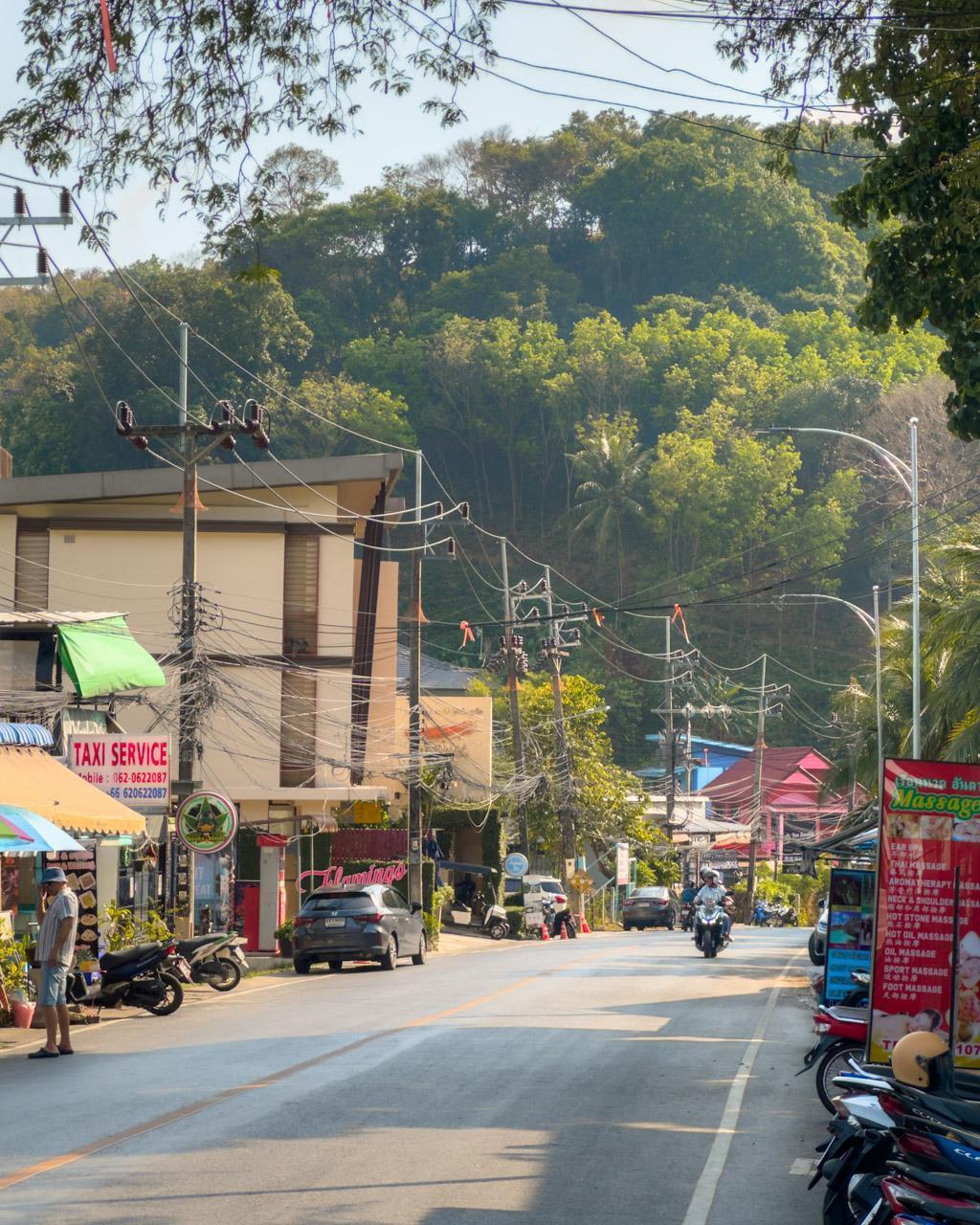 Main street by Ao Yon Beach in Phuket with restaurants, massage parlours, tour operators etc.