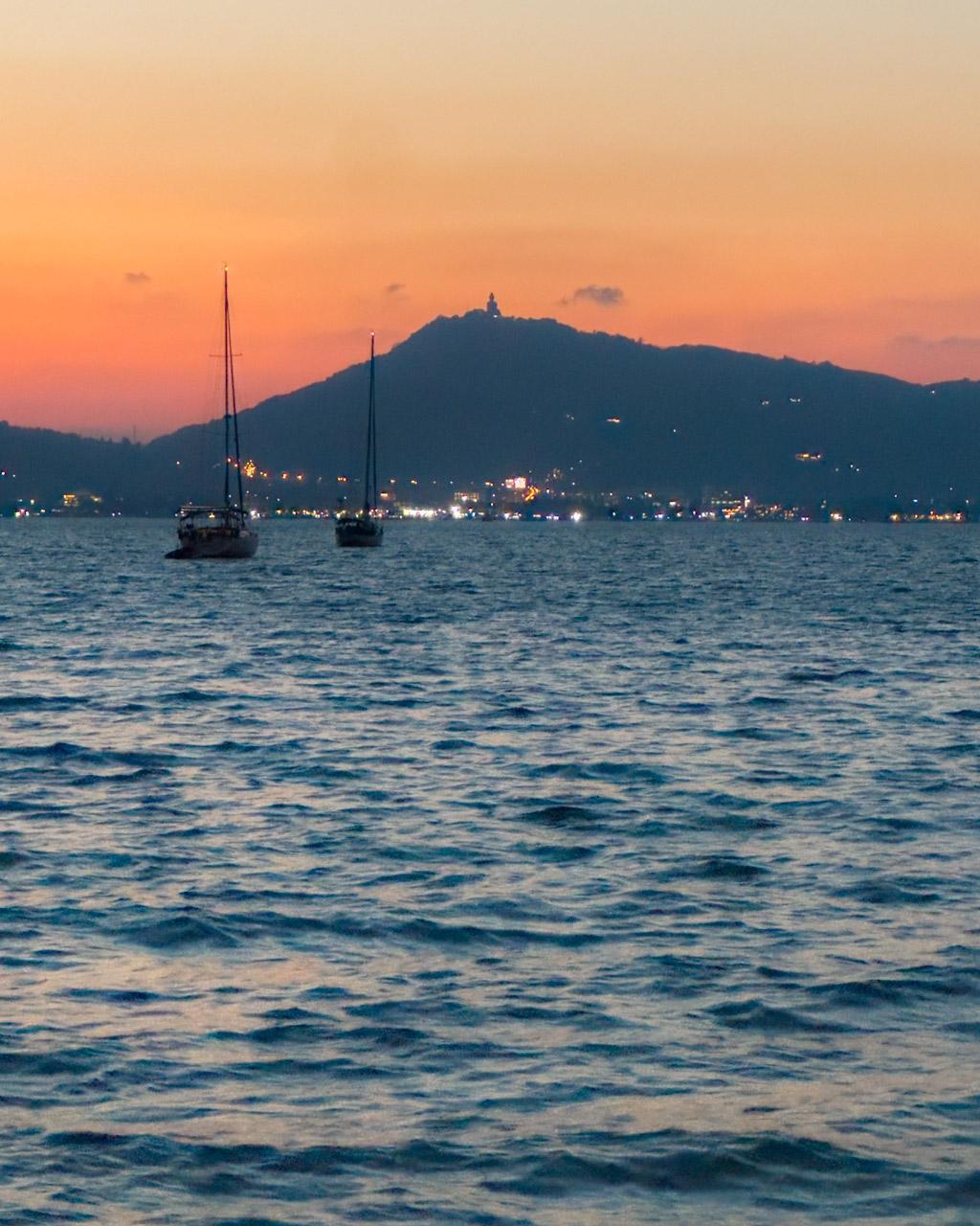 Sunset from Khao Khad Beach, with the Big Buddha just visible on the hill across the bay