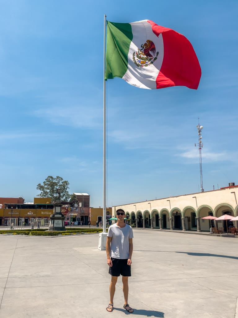 Alex and a big Mexican flag at Plaza de la Concordia