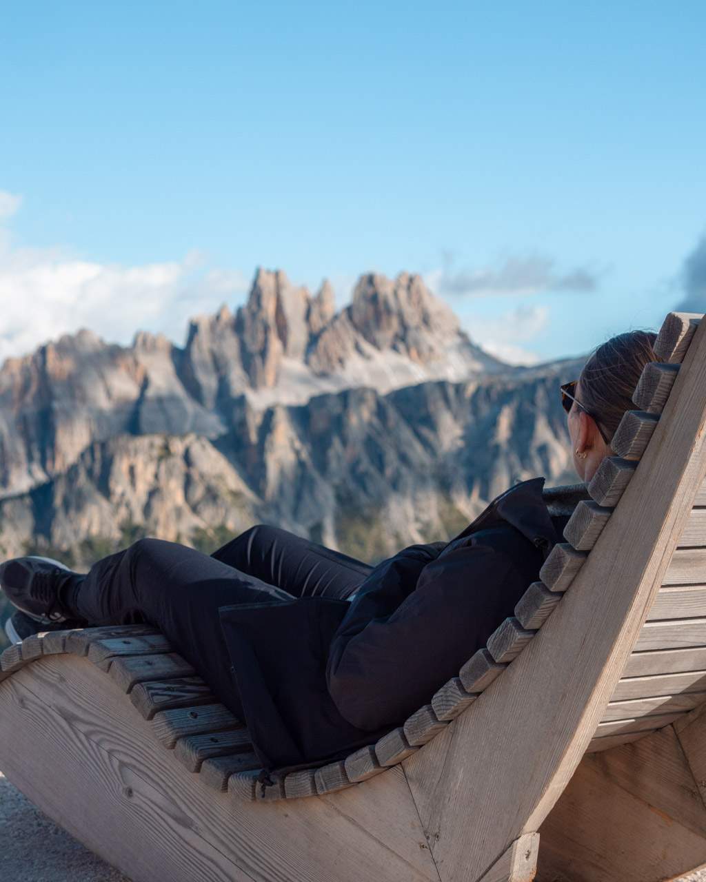 Victoria looks out over mountain landscape in the Dolomites