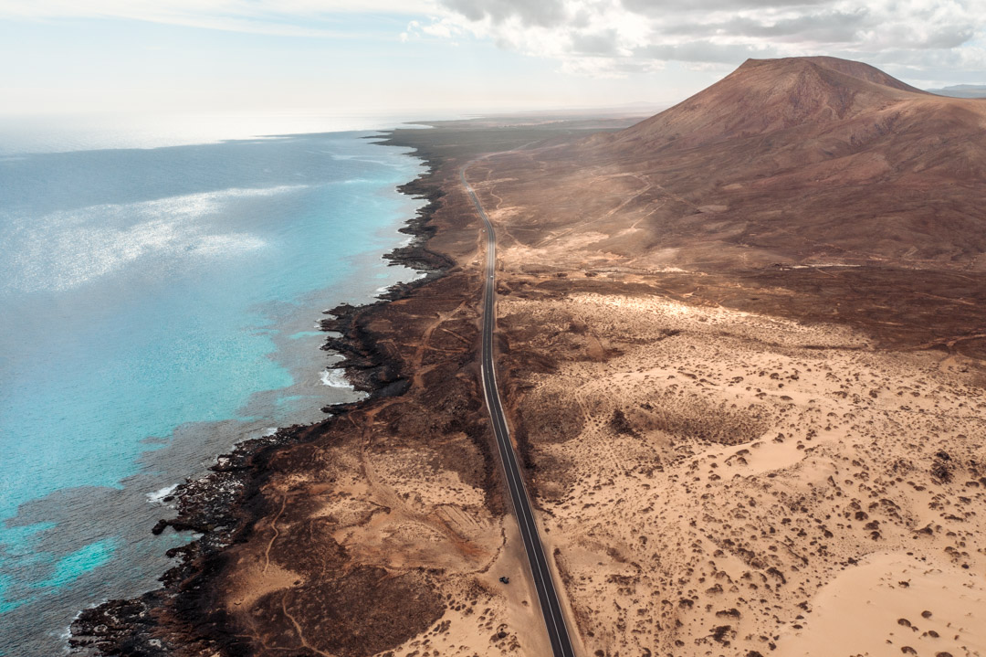 Drone view of the coastal road to Corralejo natural park