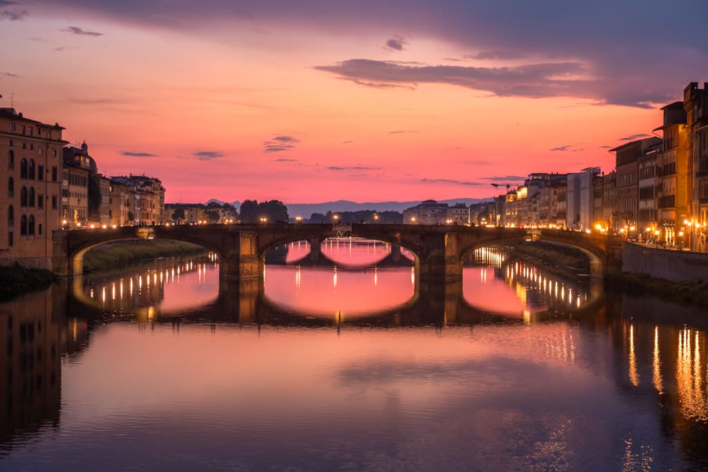 The neighbouring bridge Ponte Santa Trinita seen from Ponte Vecchio at sunset