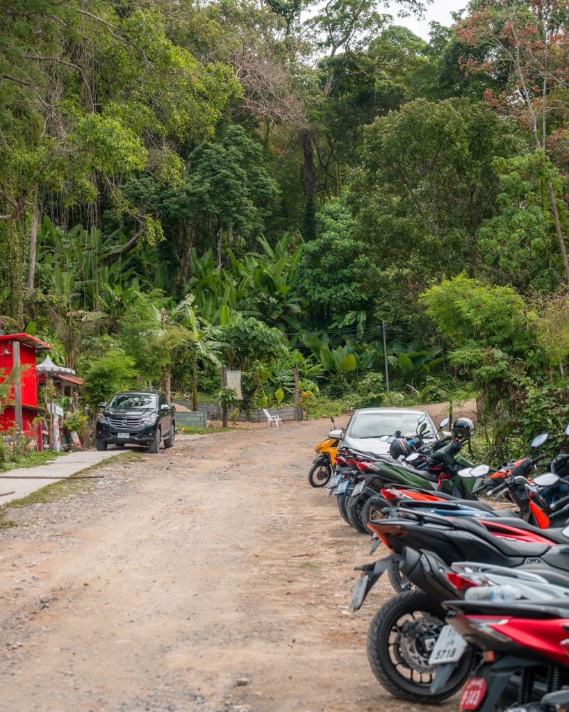 Scooters and cars parked at Freedom Beach