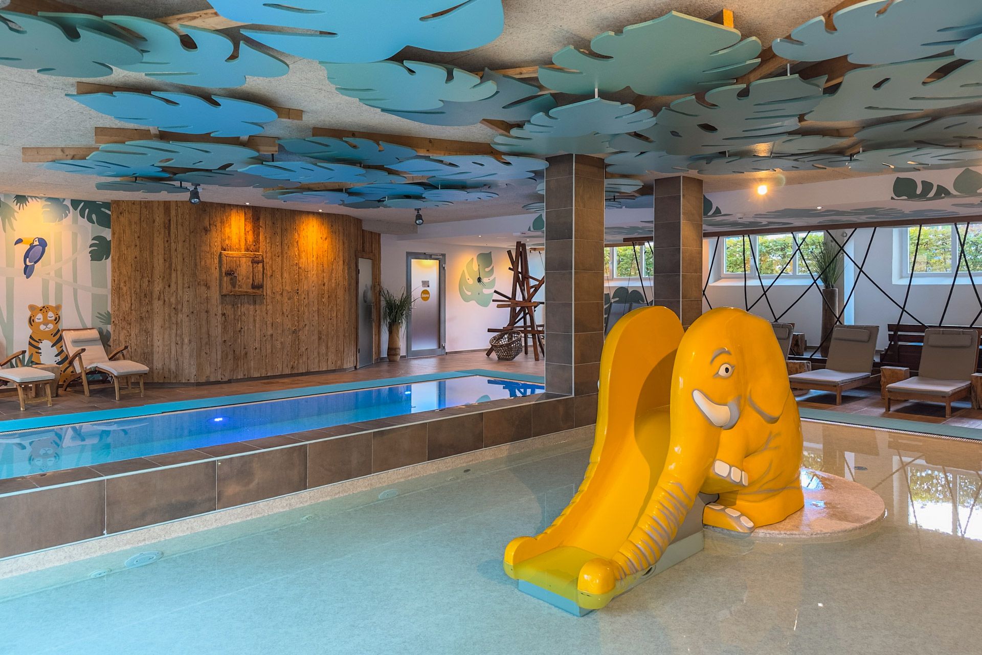 The pool area at Leiners with the yellow elephant slide in the shallow section and the deeper pool behind