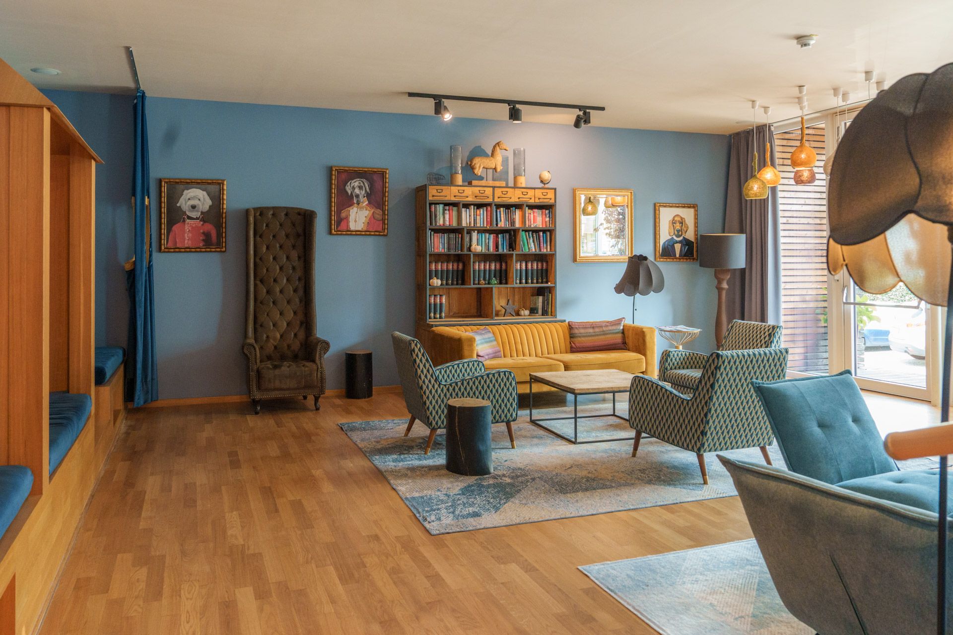 Lounge area at Leiners with bookshelves and armchairs