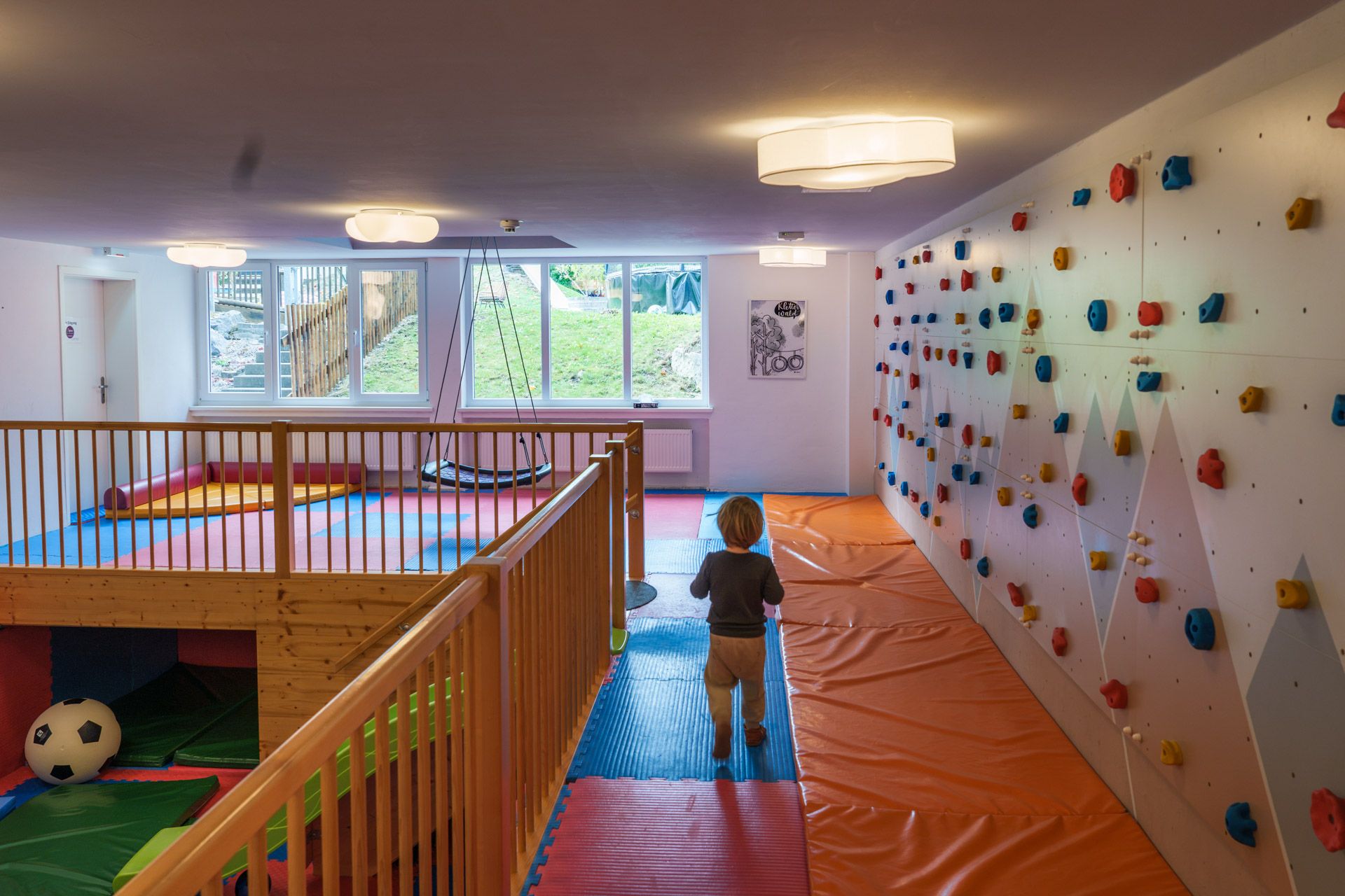 Climbing wall and slide in the playroom at Leiners