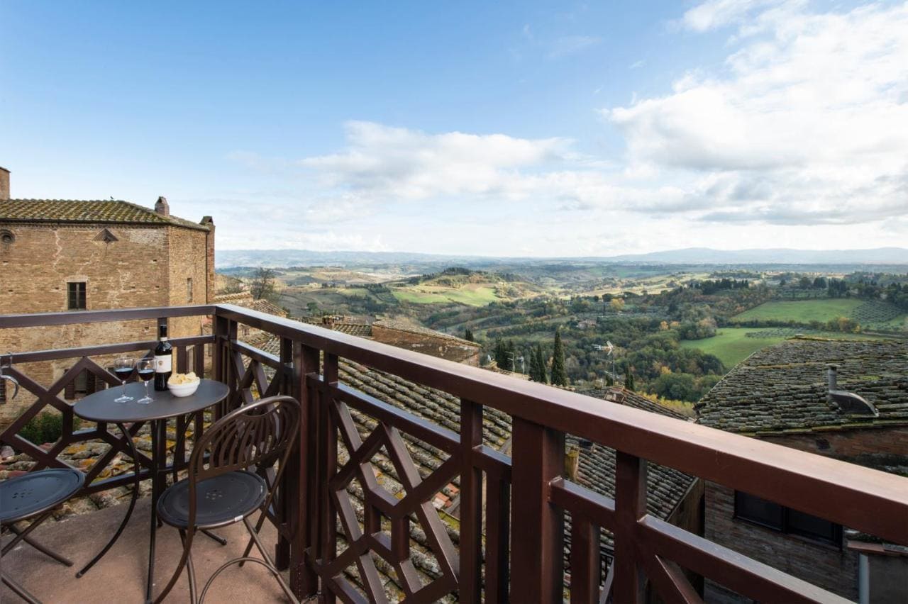 Terrace at La Cisterna in San Gimignano overlooking the Tuscan countryside