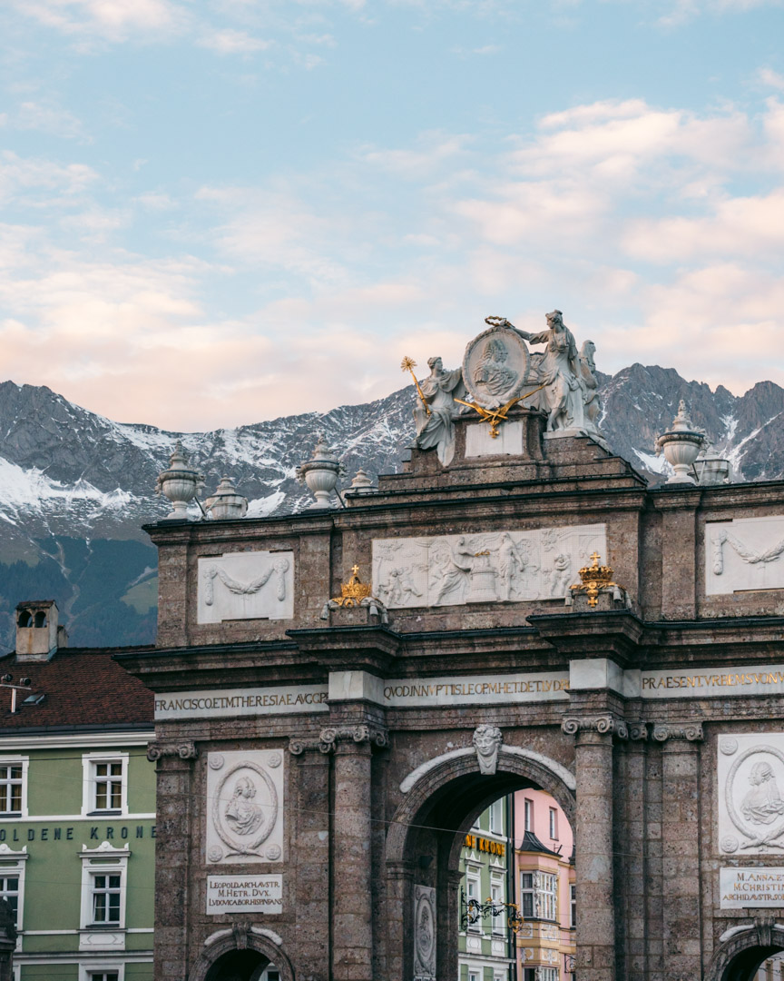 The Triumphal Arch in Innsbruck with the Nordkette Range behind it
