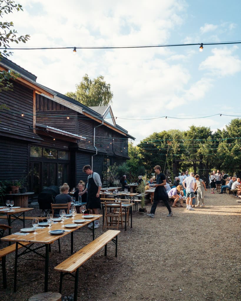 BaneGaarden in summer with long tables and sunshine