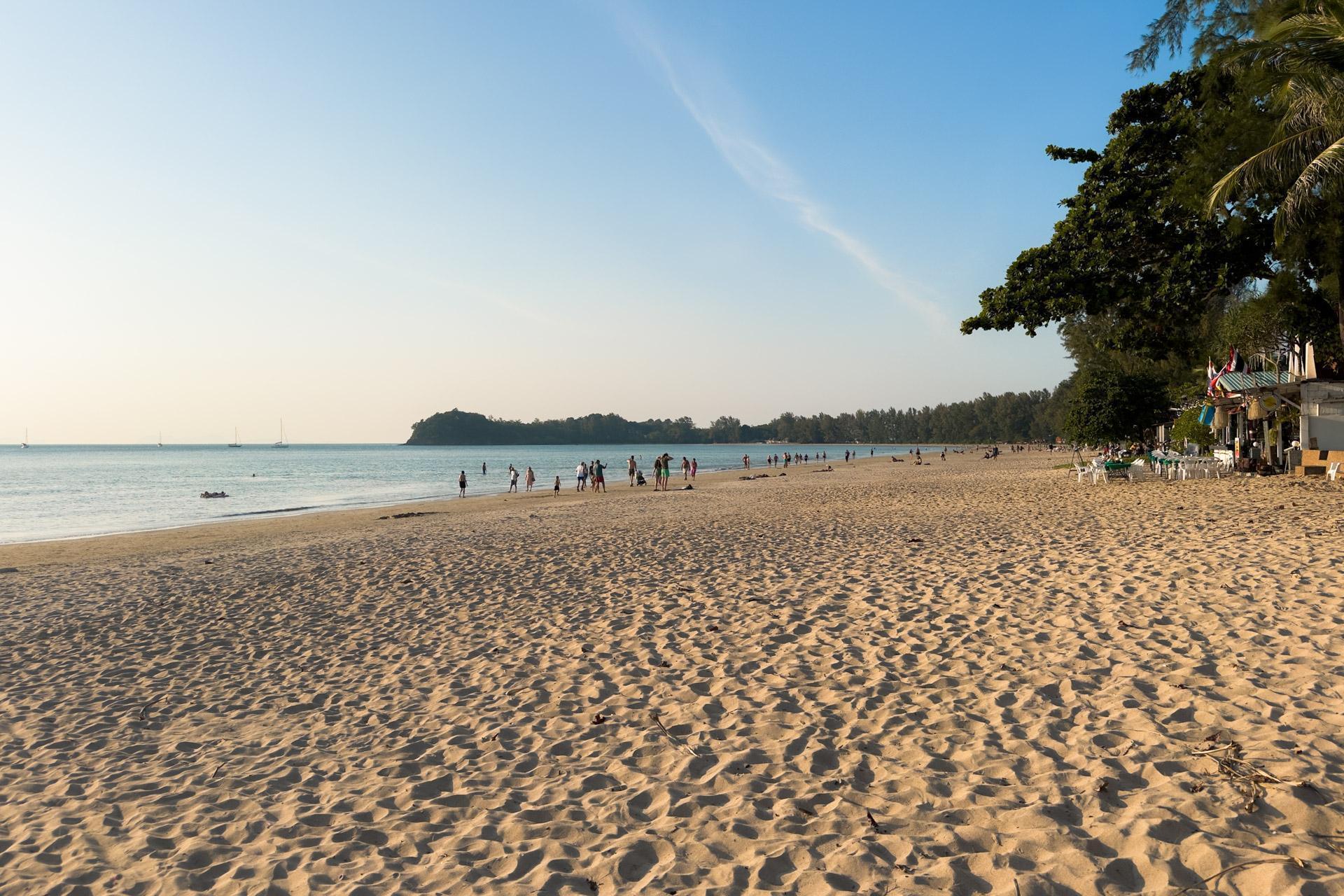 Klong Dao beach shot showing the sand and a few beachgoers