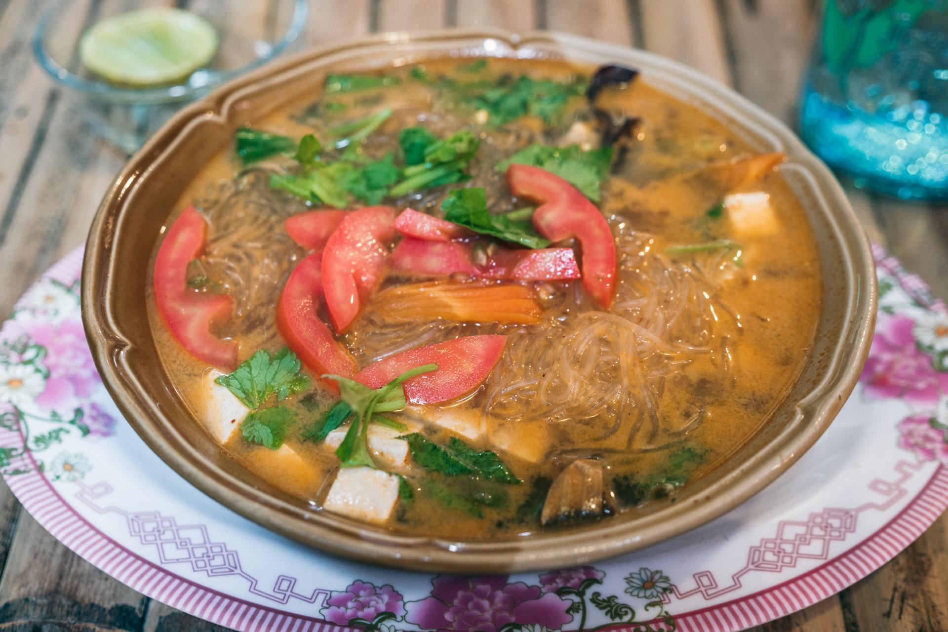 Sweet and sour soup with tofu and fresh vegetables.