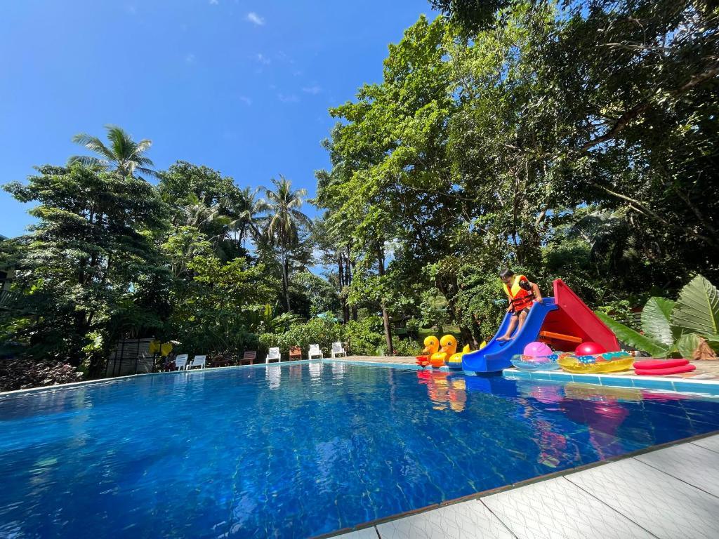 Pool with slide at Koh Mook Garden Beach Resort.