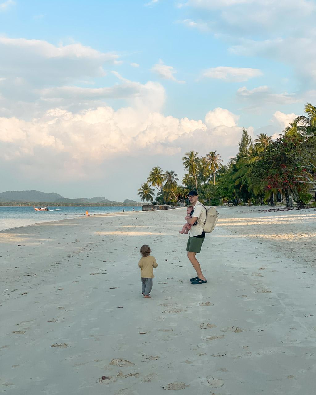 Alex walking on the beach on Koh Mook with Adrian and Zoe