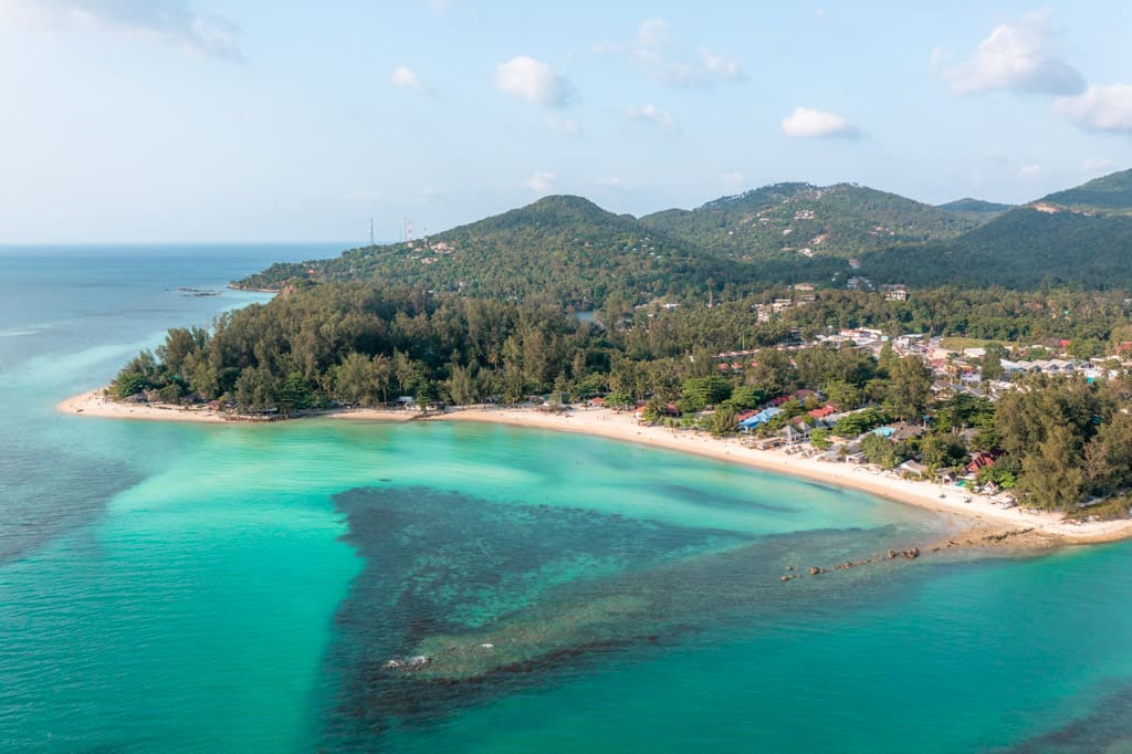 The fine sand and blue waters of Sri Thanu Beach. Zen Beach can be seen to the left