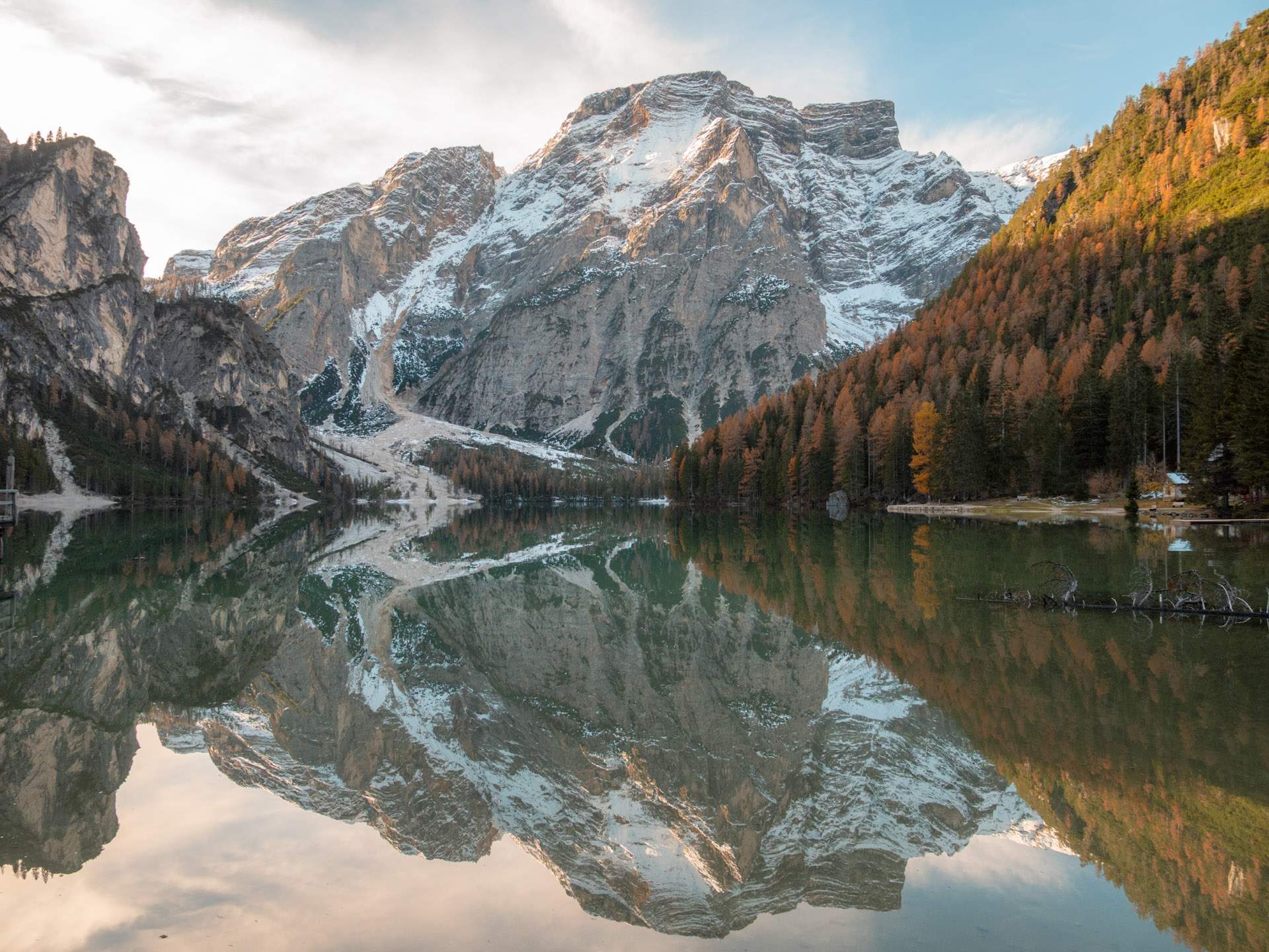 Lago di Braies with mirror-like water and towering mountains