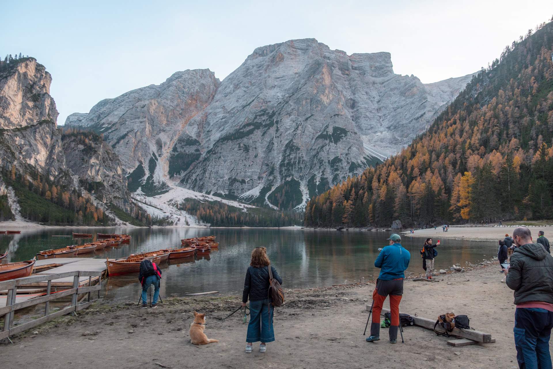 People at Lago di Braies in autumn