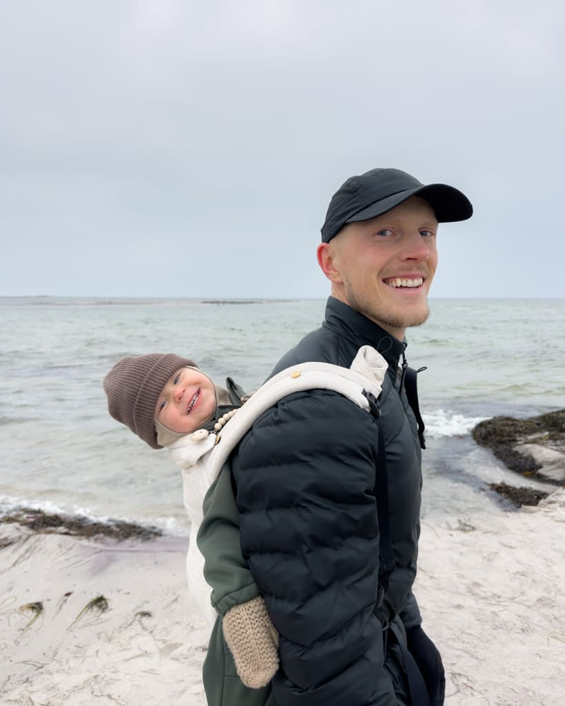  Alexander with his son Adrian on his back in a carrier with the seals in the background