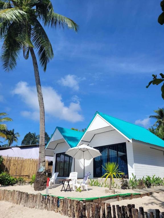 One of the beachfront bungalows at Mook Tawan Beach House, just steps from the sand.