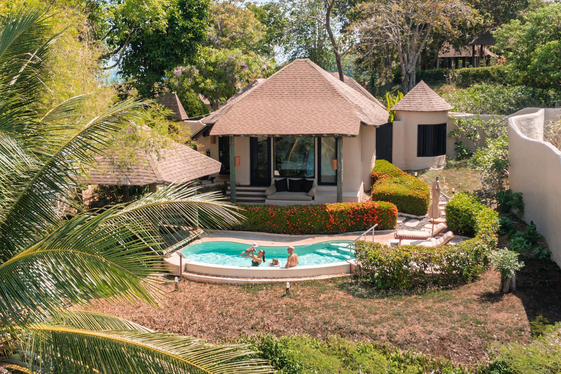 Alex, Victoria, Adrian and Zoe in the pool in front of the villa at Naka Island