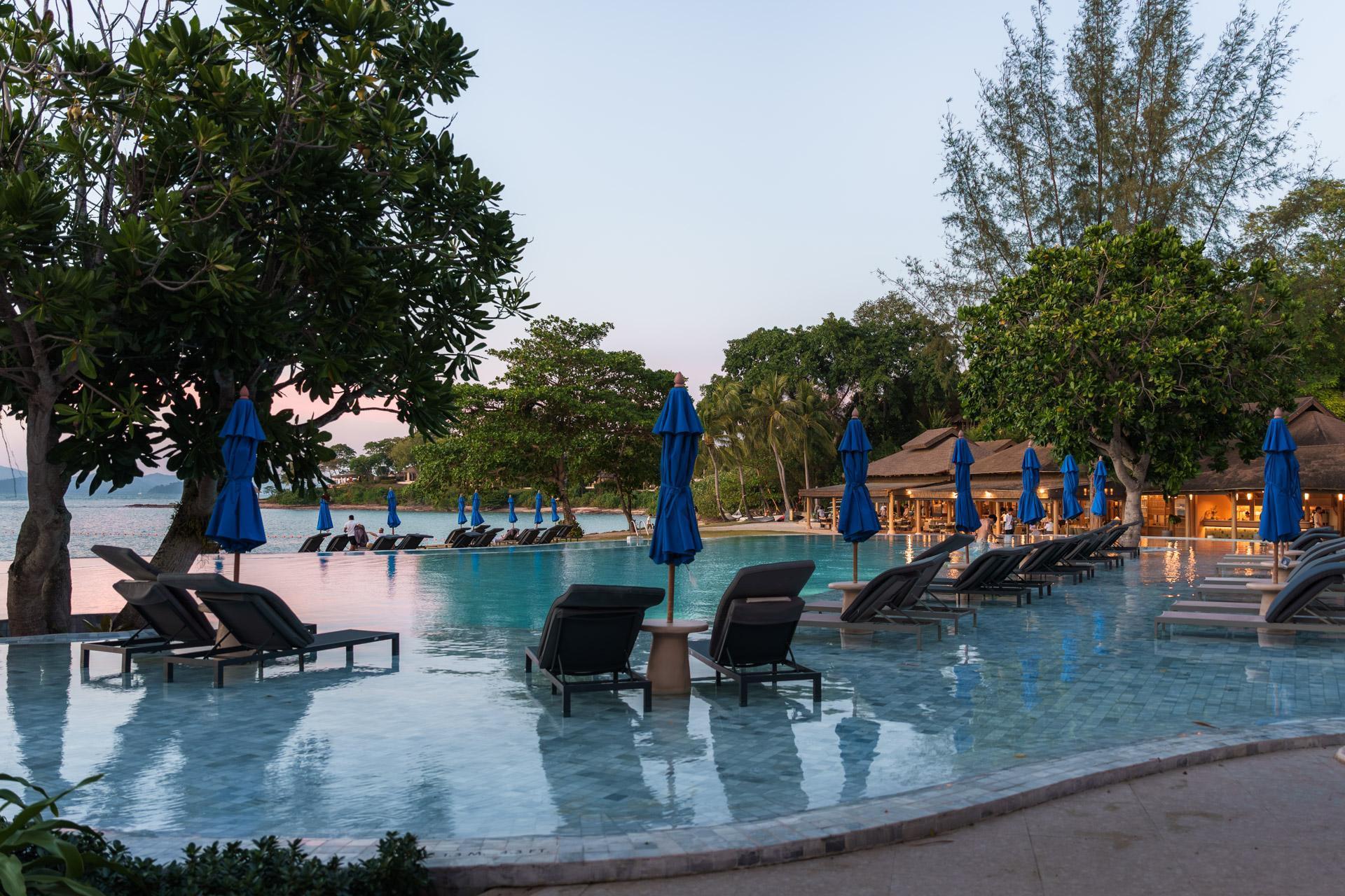 Sun loungers in the shallow water of the pool