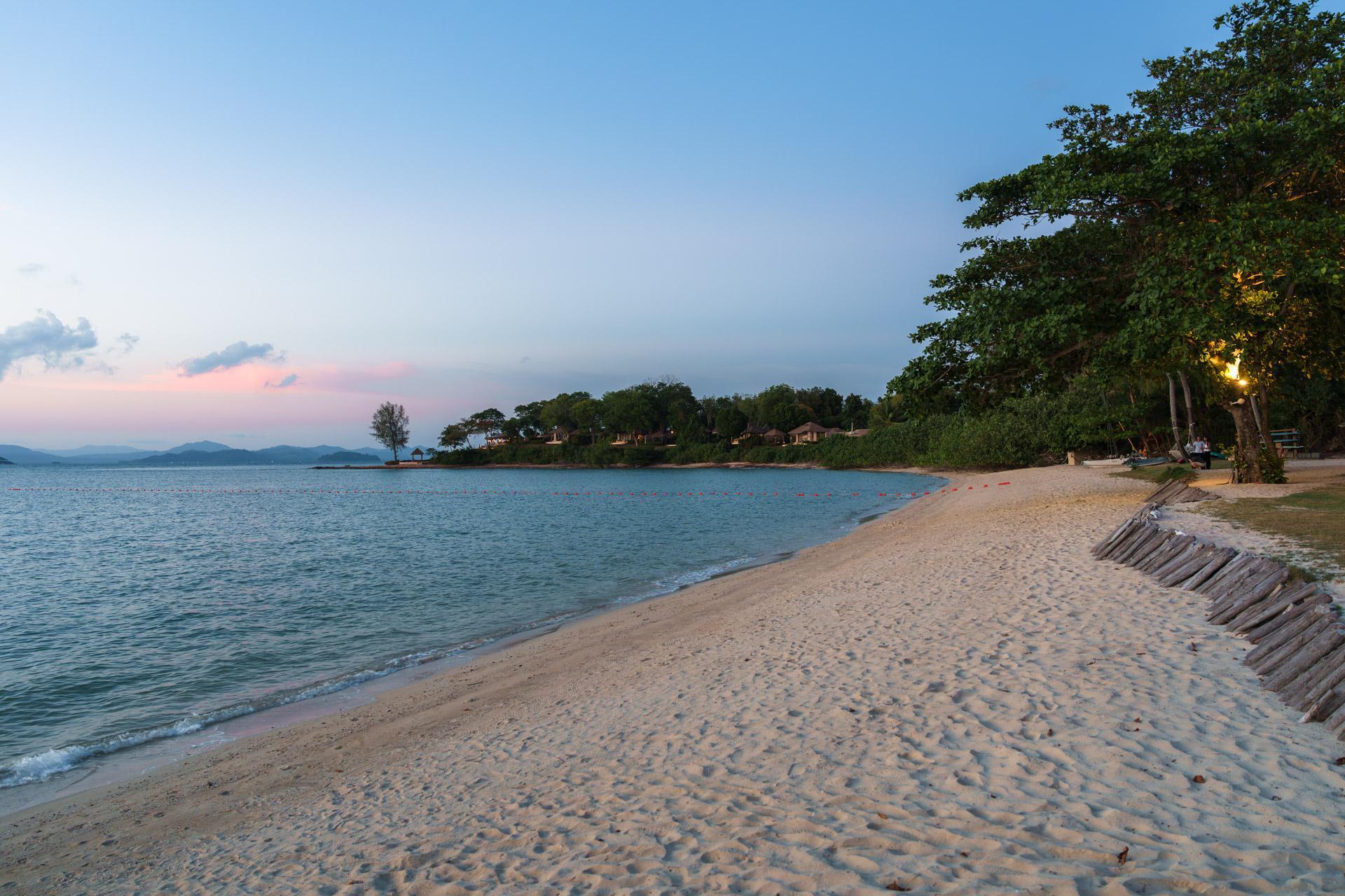 The beach at The Naka Island at sunset