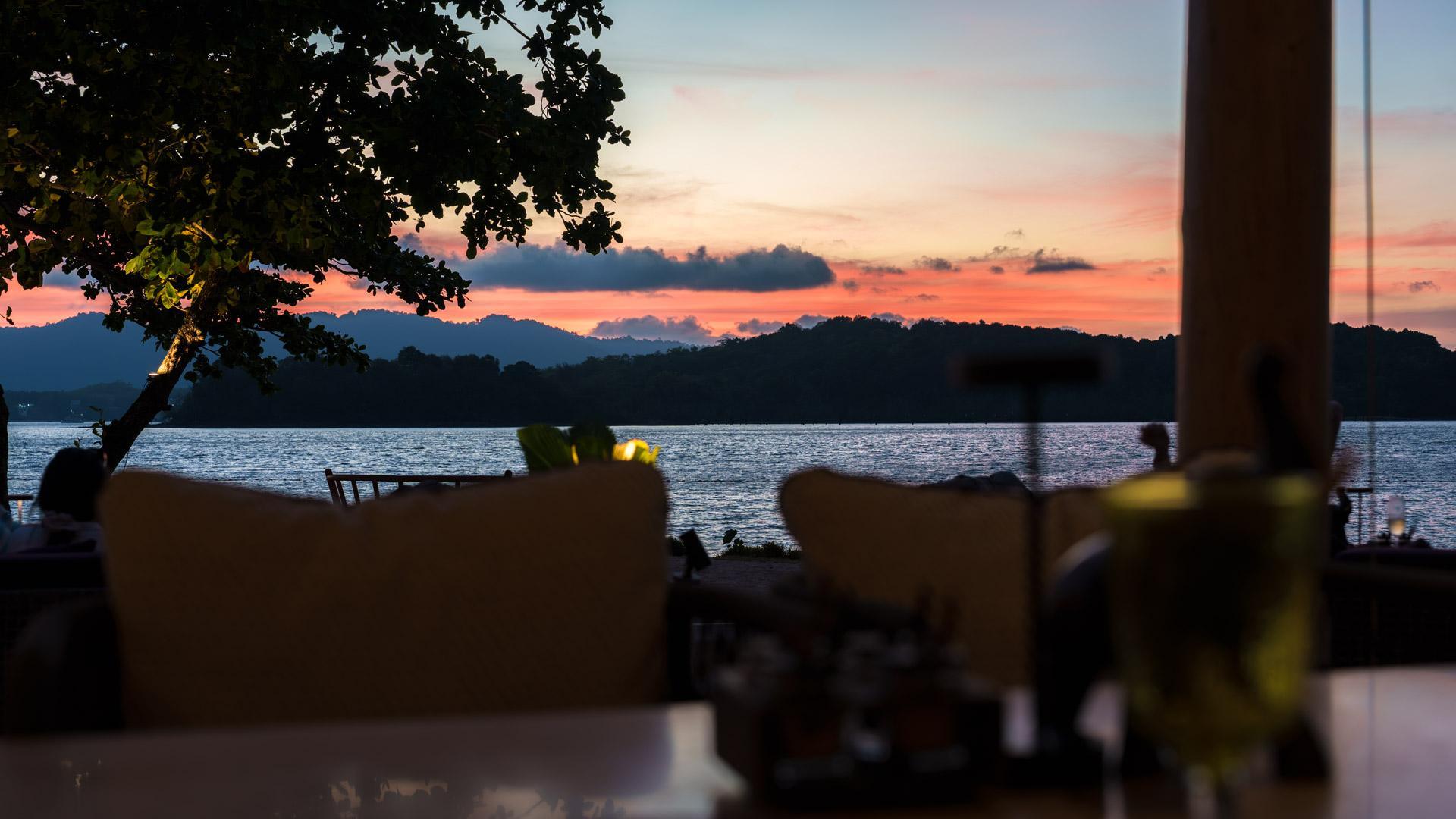 Dusk view from Aiyara with a blurry table set in the foreground