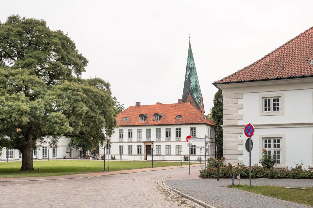 The entrance to the Old Town of Eutin from Eutin Castle with the tower of the Church of Saint Michael popping up behind the houses