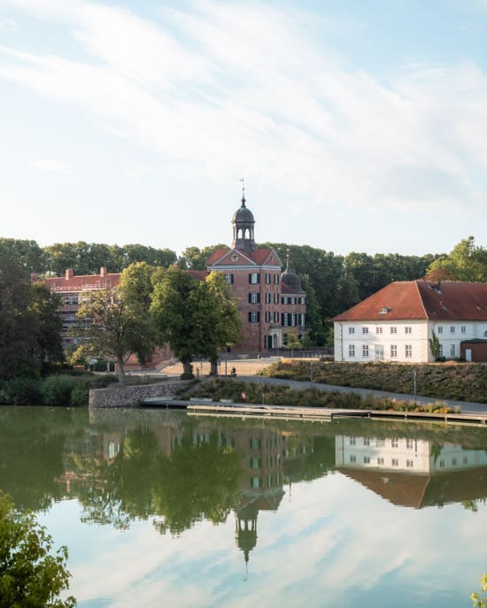 The castle's location right next to the lake