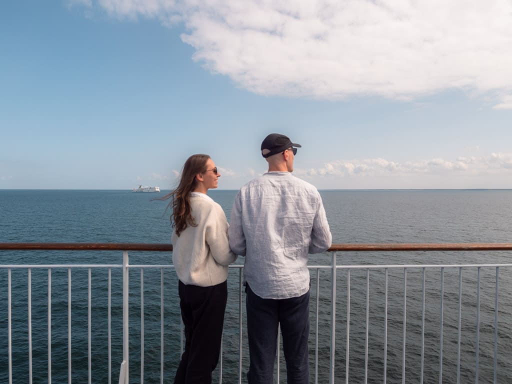 Alex & Victoria at the ferry looking out towards the water