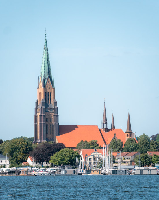 Schleswig Cathedral dominates the skyline as seen from the south bank of the Schlei