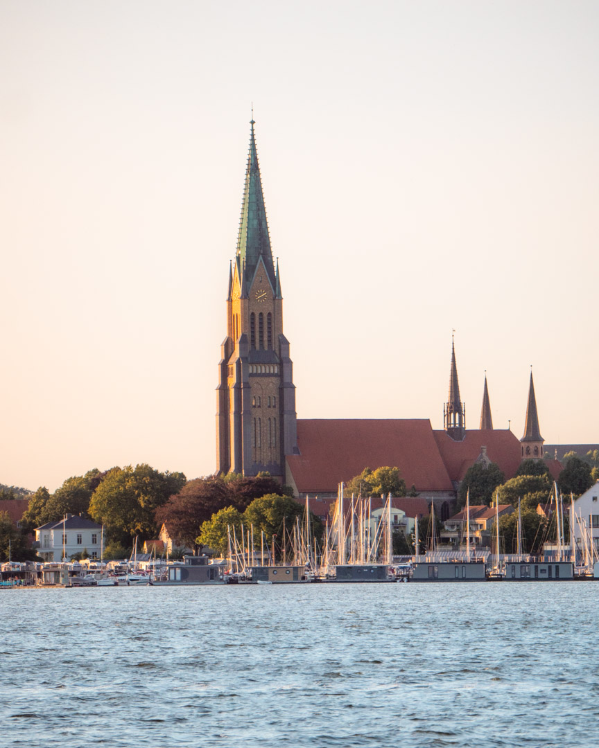 Schleswig's cathedral tower from the south bank of the Schlei