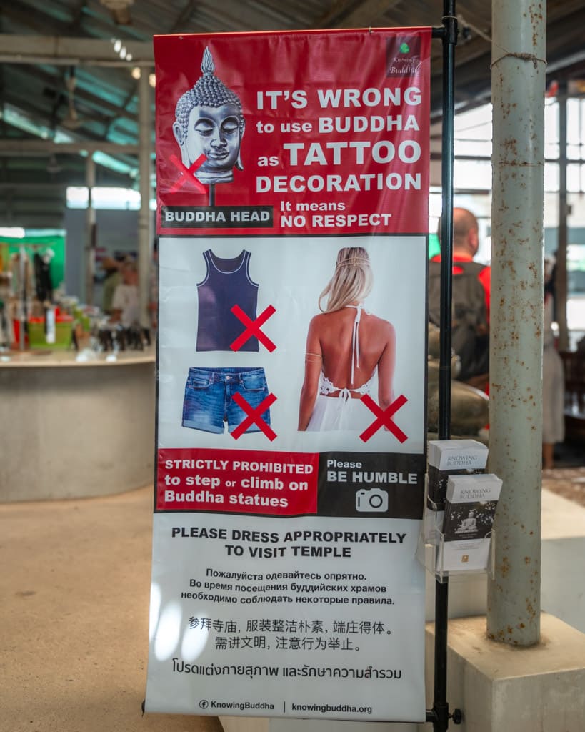 Banners with guidelines for how to dress at the Big Buddha