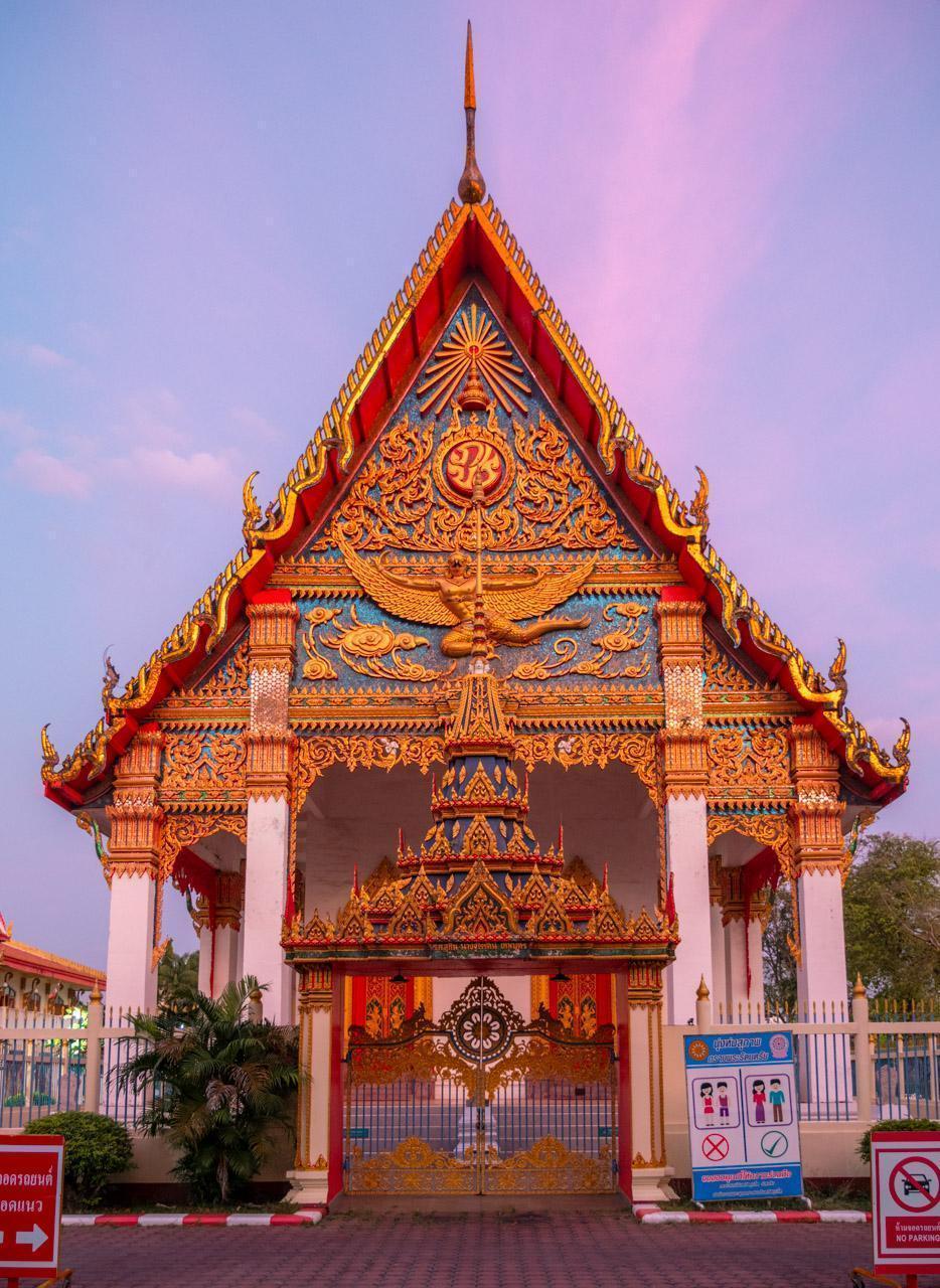 Wat Mongkol Nimit with sunset sky