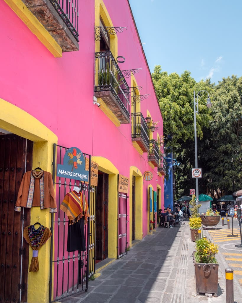 Pink and yellow facade at the alley of the frogs in Puebla
