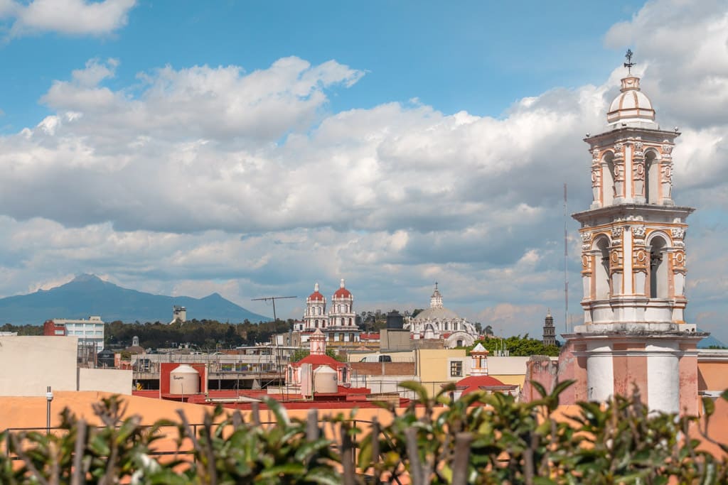Views from the outdoor terrace at Museo Amparo in Puebla towards volcanoes in the distance