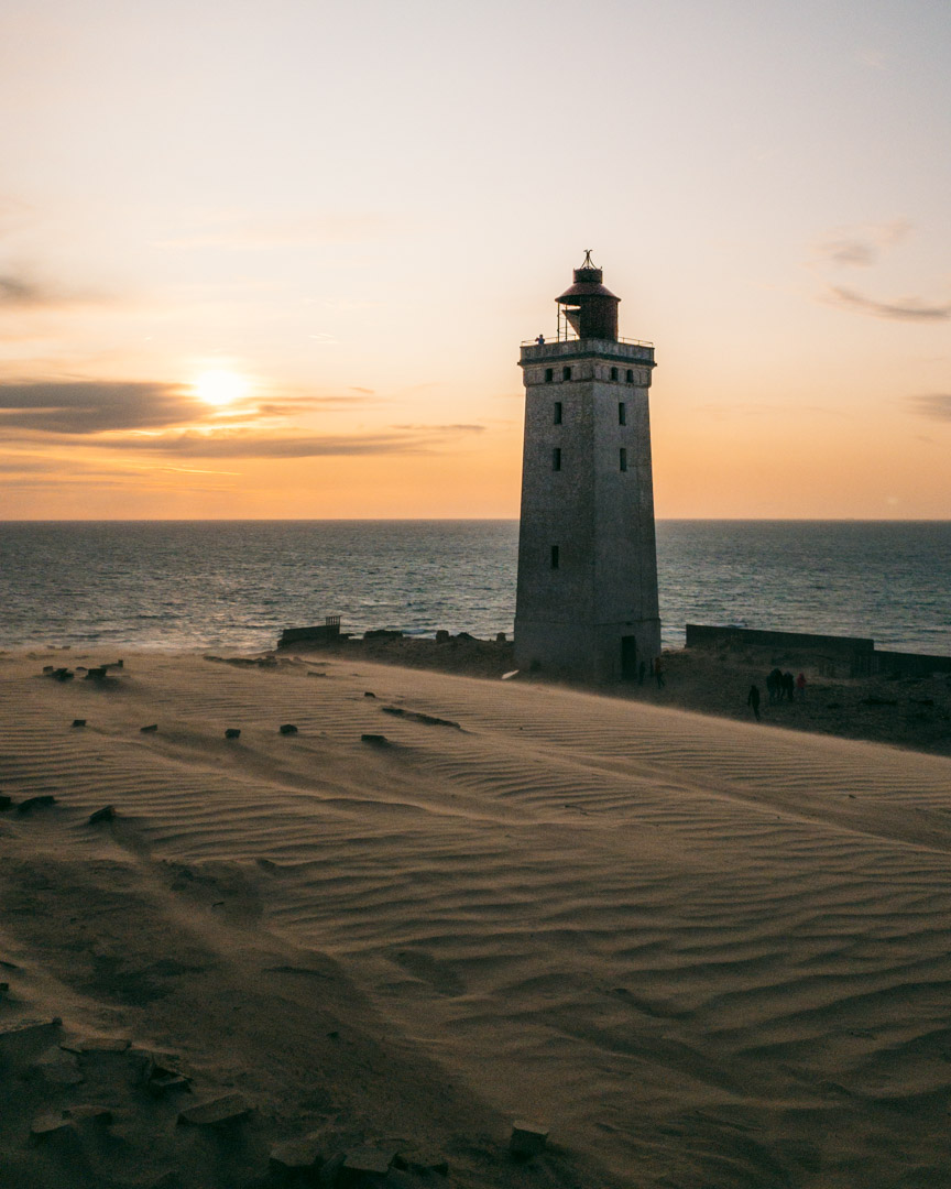 The sun setting behind Rubjerg Knude Lighthouse