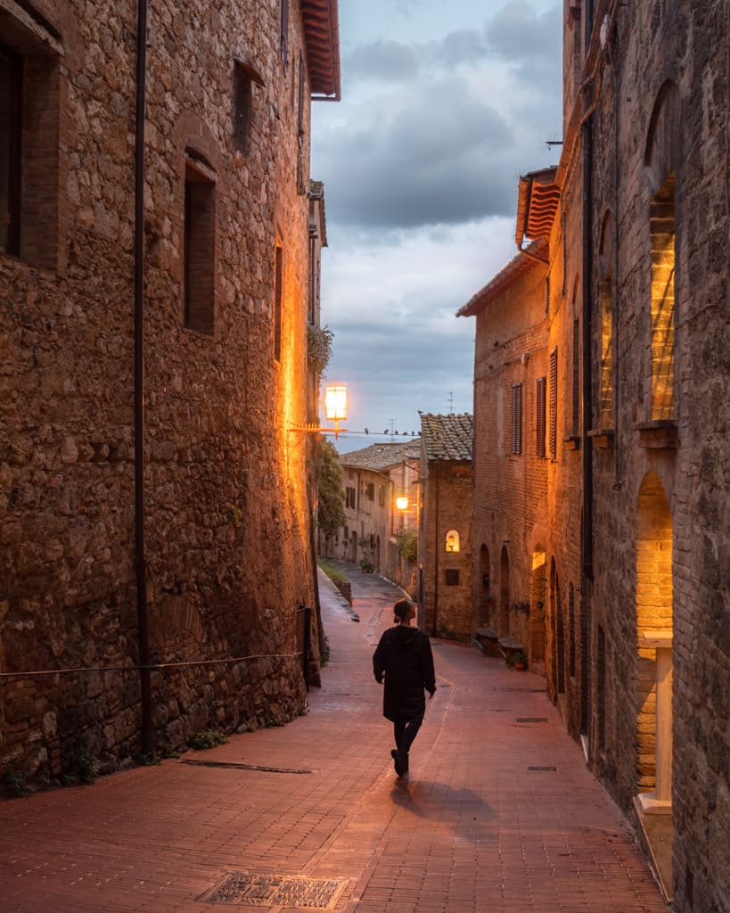 Victoria on a quiet street in San Gimignano at night