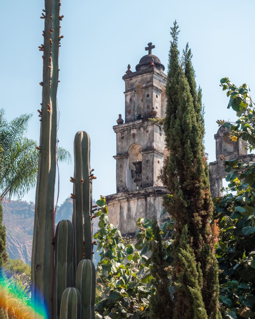 Church seen through trees in Tepoztán