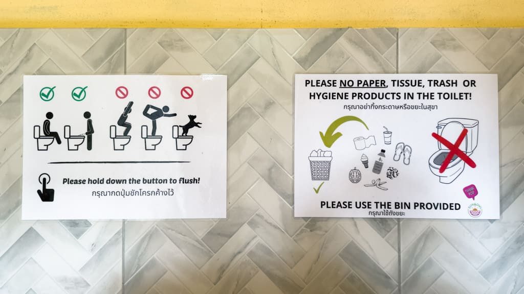 Signs with instructions for using the toilet in Thailand